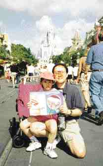 Cinderella's Castle at Disneyworld, FL, was the ideal spot for Dr. Sean Ko, Dr. Sylvia Lee, daughter Carolyn and son Jonathan to check out their issue of Oral Health.