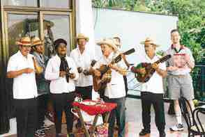 A local band playing near Havana, Cuba, momentarily distracts Dr. Michael Pollak from his November '99 Oral Health.