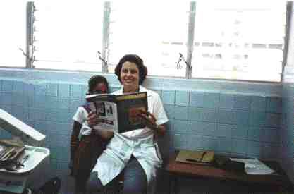 Dr. Ivalise Alvarez Rosa and friend in Cienfuegos, Cuba with their favorite dental journal.