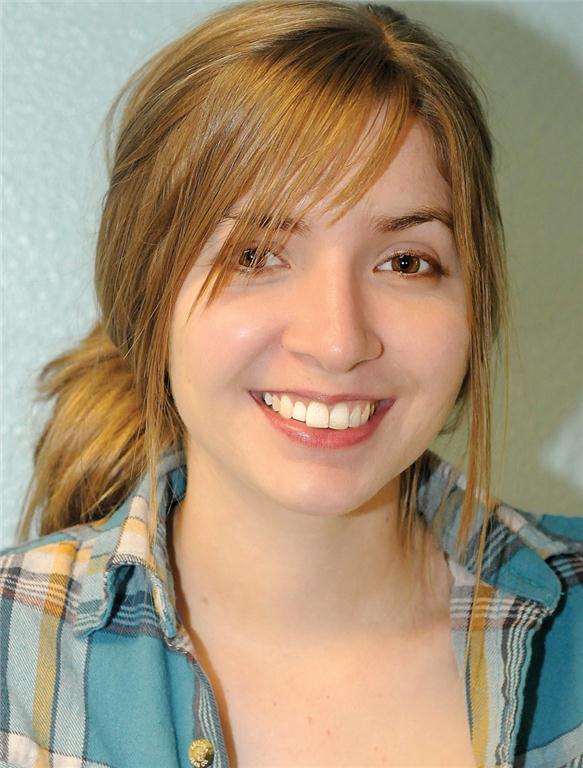 Figure 21. Post-treatment full-facial view of the patient, radiant, confident, and demonstrating a natural-looking smile.