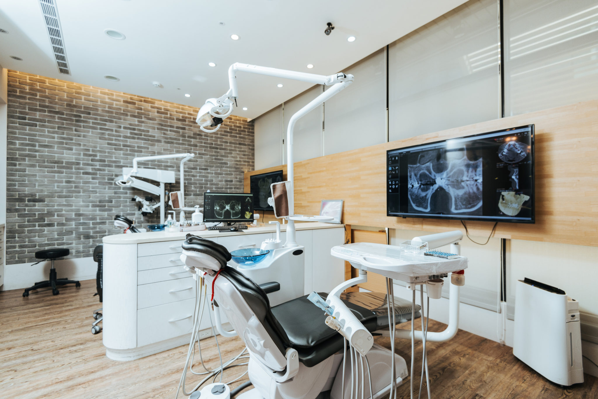 Dentist office with modern equipment and microscope alternate text for this image