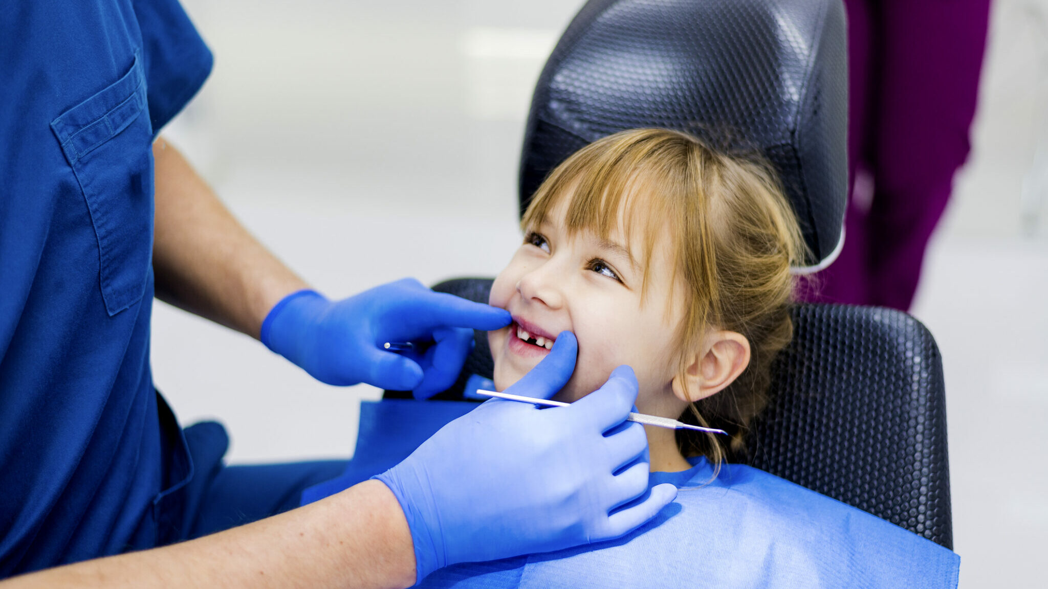 Cute girl teeth checkup at dentist’s office alternate text for this image