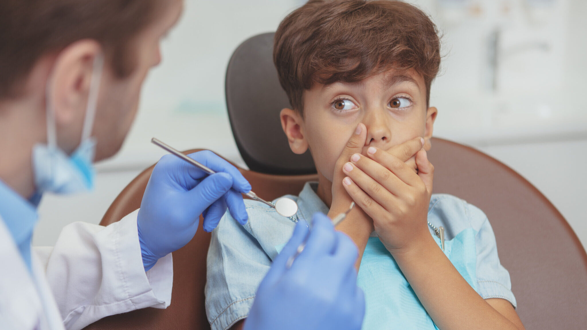 Little boy visiting dentist for medical checkup alternate text for this image