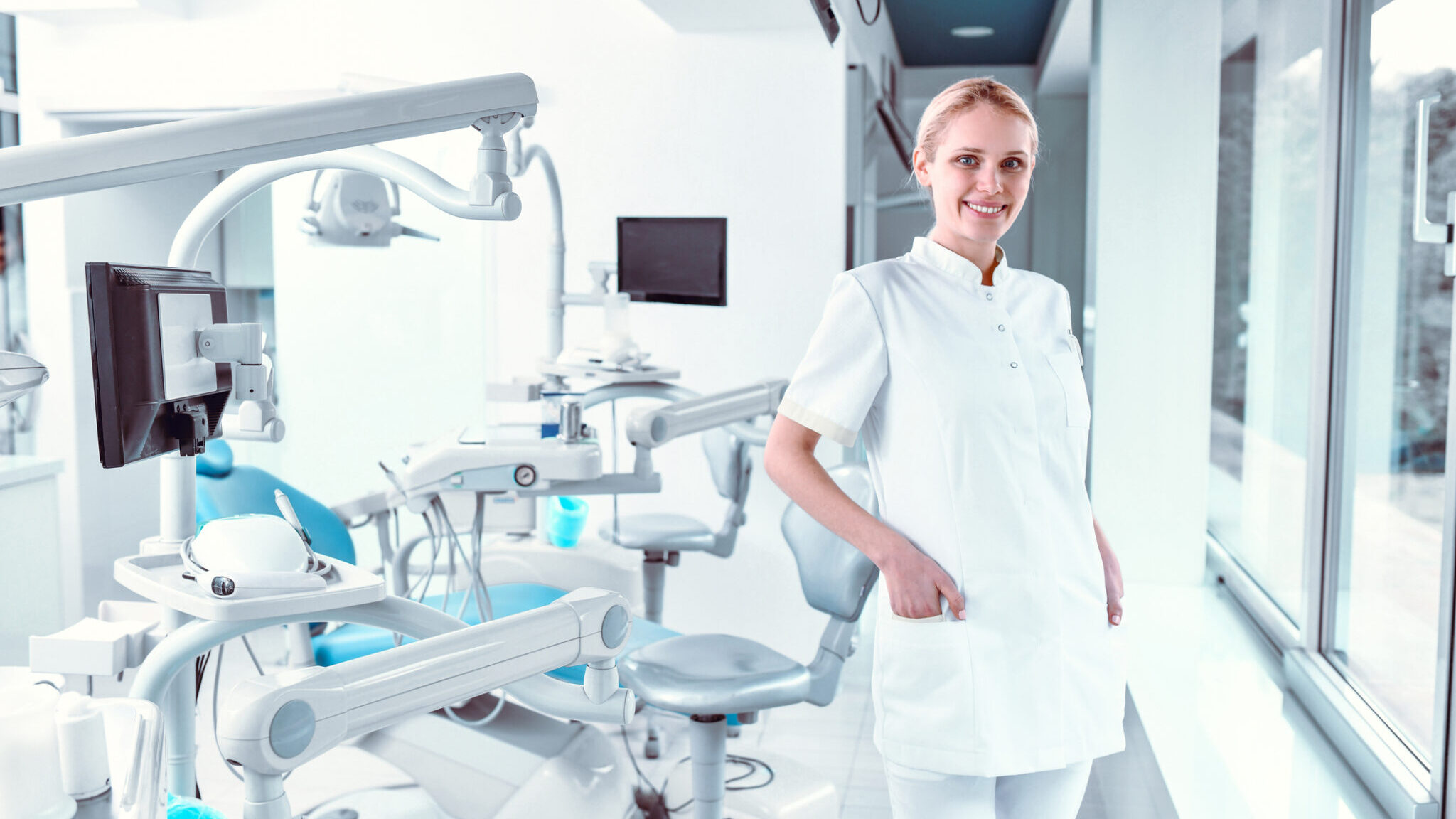 Smiling Female Dentist Showing Professionalism And Hygiene In Her Spotless Clinic alternate text for this image