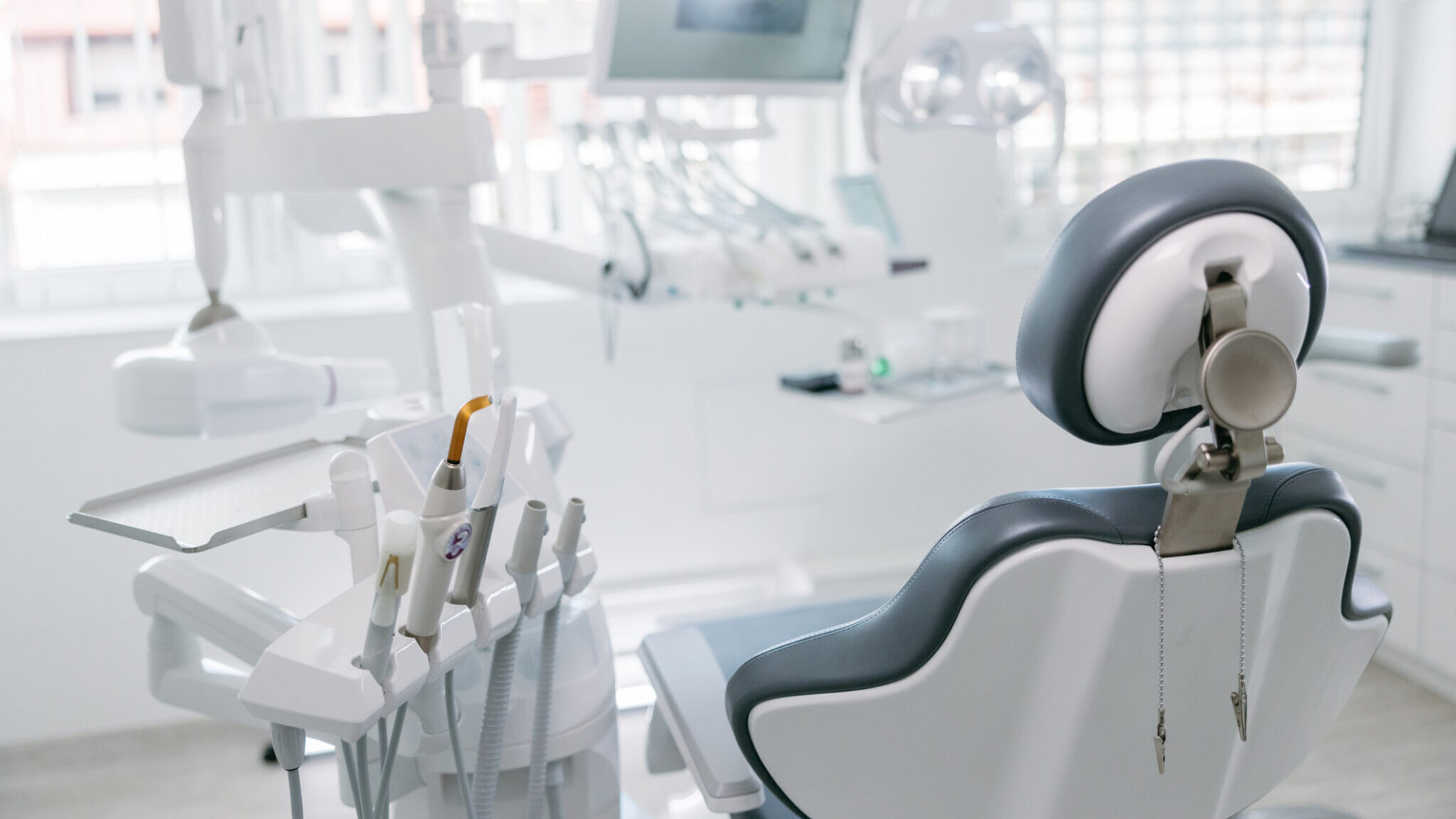 Modern dental drills and empty chair in the dentist’s office alternate text for this image