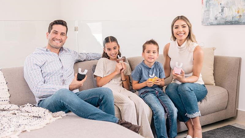 A family uses AutoBrush, the first and only U-shaped toothbrush to earn the coveted ADA Seal of Acceptance. (Photo supplied)