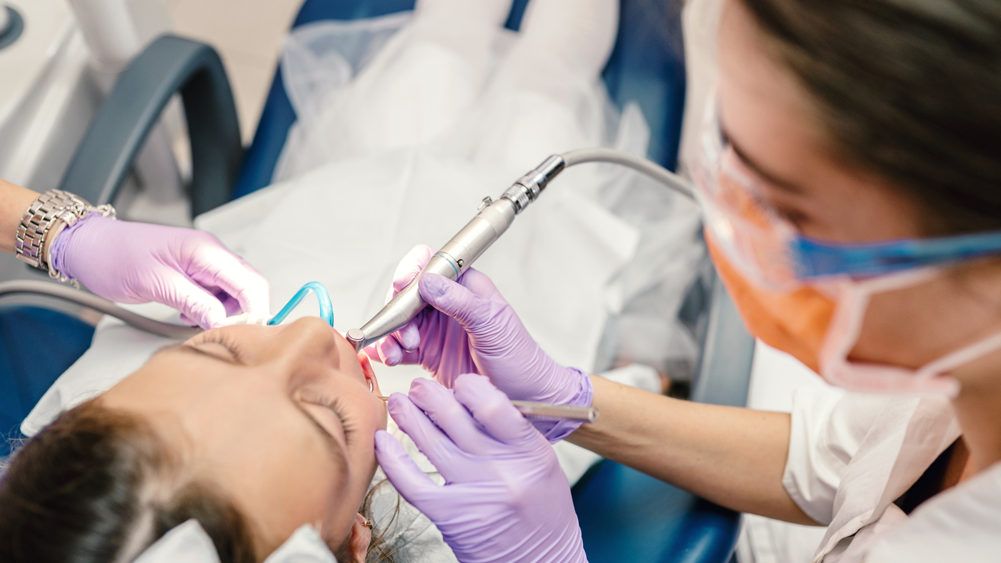 hygienist helping-dental care alternate text for this image