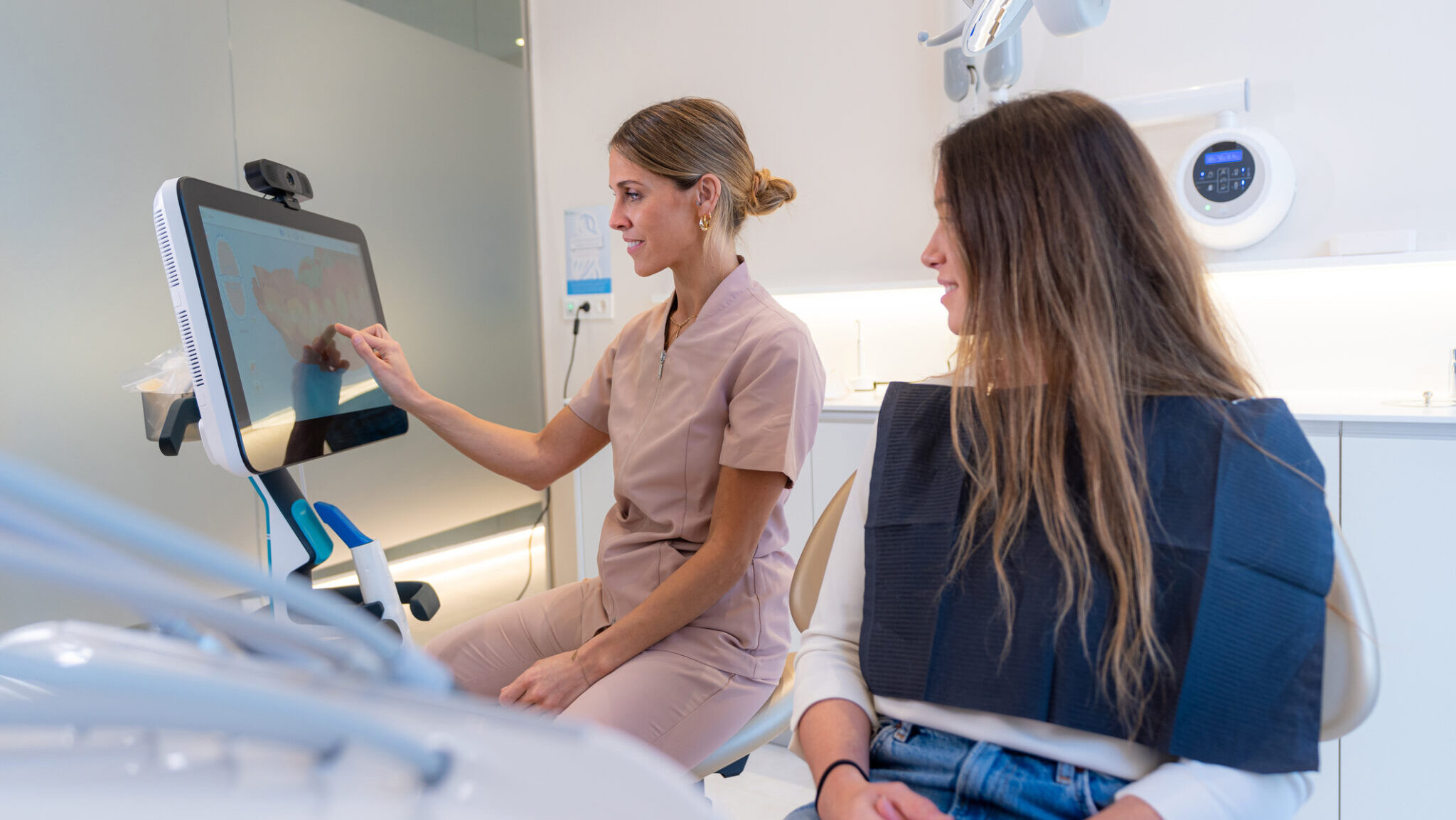 Dentist using modern technology to explain a dental procedure to a patient