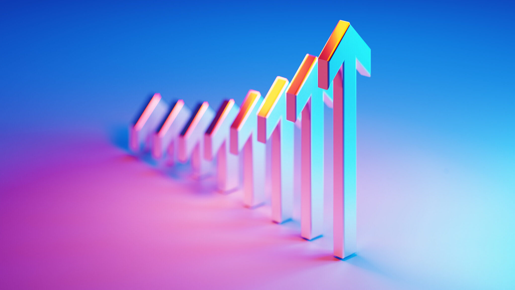 Metallic arrow symbols which are illuminated by blue and magenta lights forming a graph on blue and magenta background. Horizontal composition with selective focus.